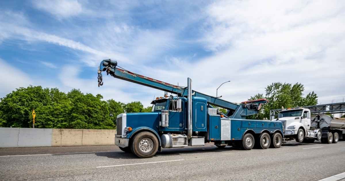 Randleman Towing heavy-duty rotator wrecker recovering a disabled semi-truck near High Point, NC